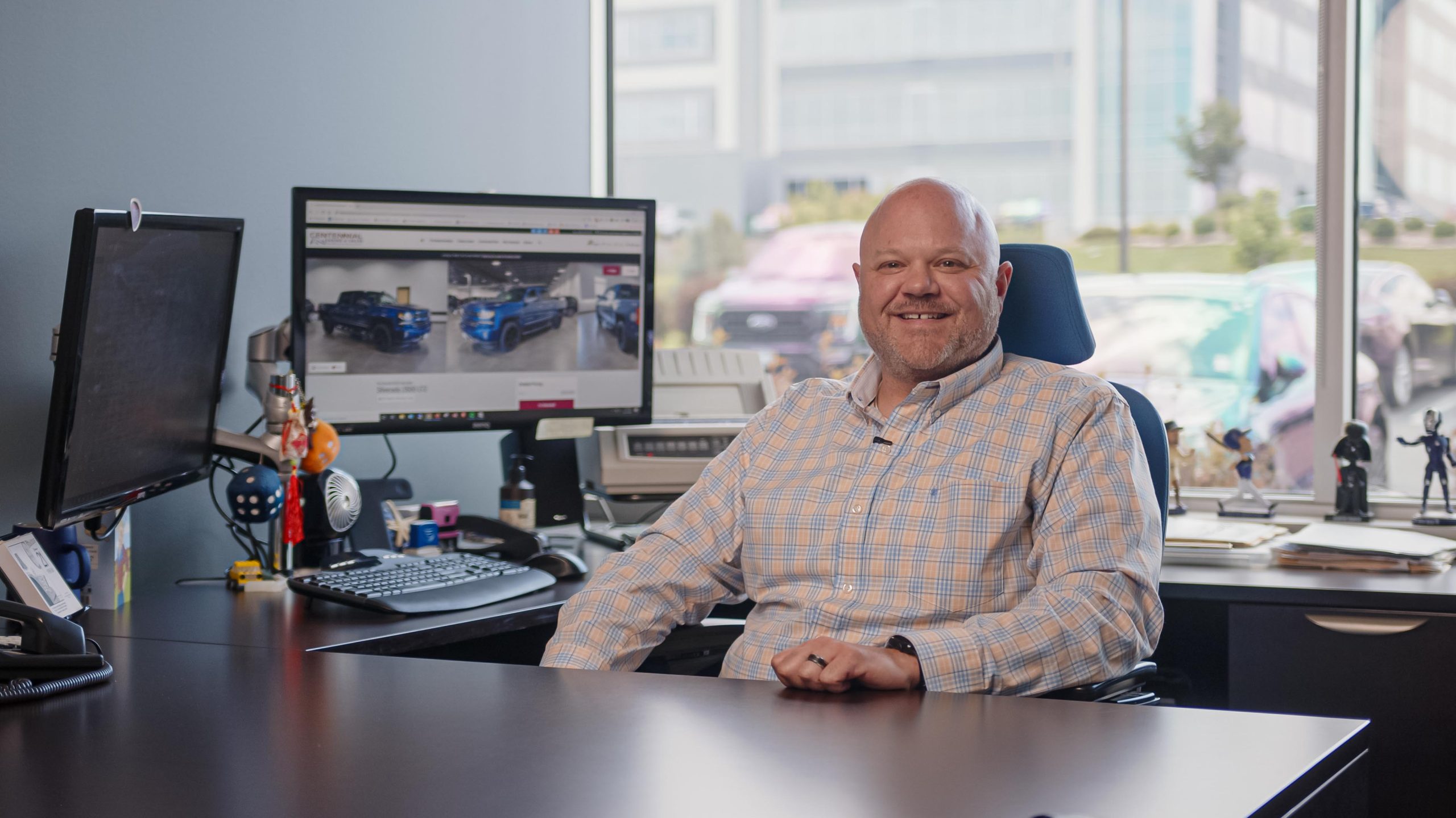 auto broker sitting at desk