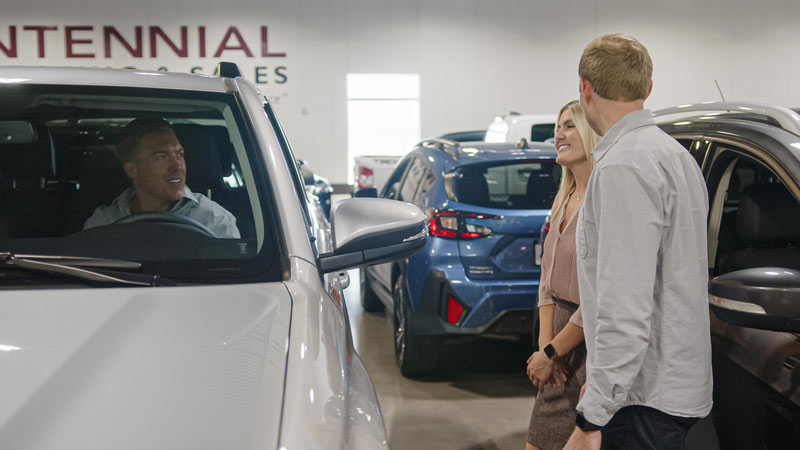 couple looking at used SUVs for sale in Denver