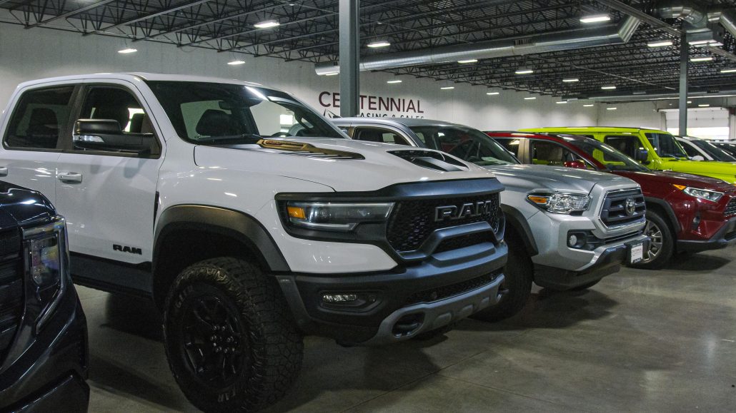 Automotive showroom with used trucks for sale in Denver